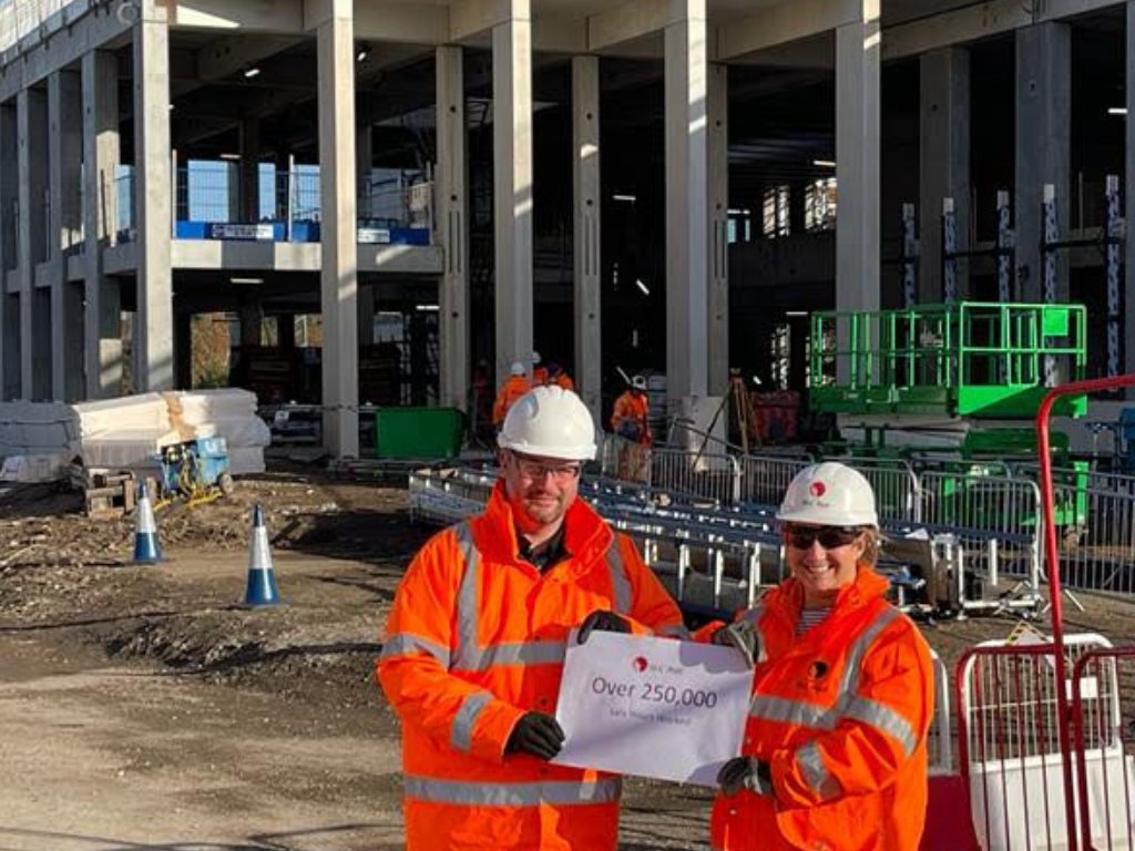 Mark Finney with Sam Uren at University Station marking 250,000 safe working hours